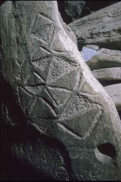 Lozenge motifs on orthostat in passage at Newgrange