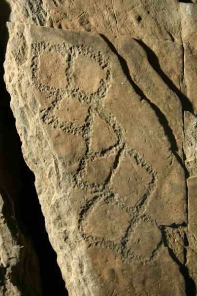 Lozenge motifs on orthostat in passage at Newgrange