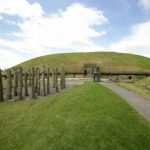 Thumbnail of http://Eastern%20view%20of%20Knowth%20Mound%20with%20reconstructed%20timber%20circle